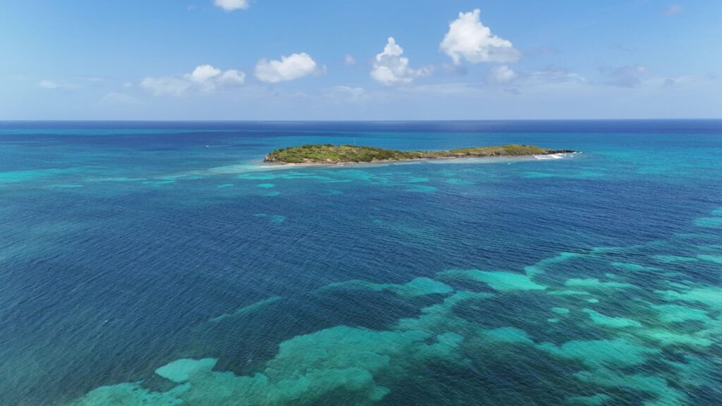 Stunning aerial view of a tropical island surrounded by clear blue waters in St. Croix, U.S. Virgin Islands