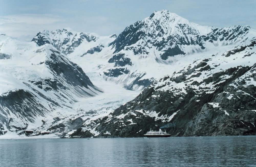 Cruise ship dwarfed by the glaciers of Glacier Bay, Alaska