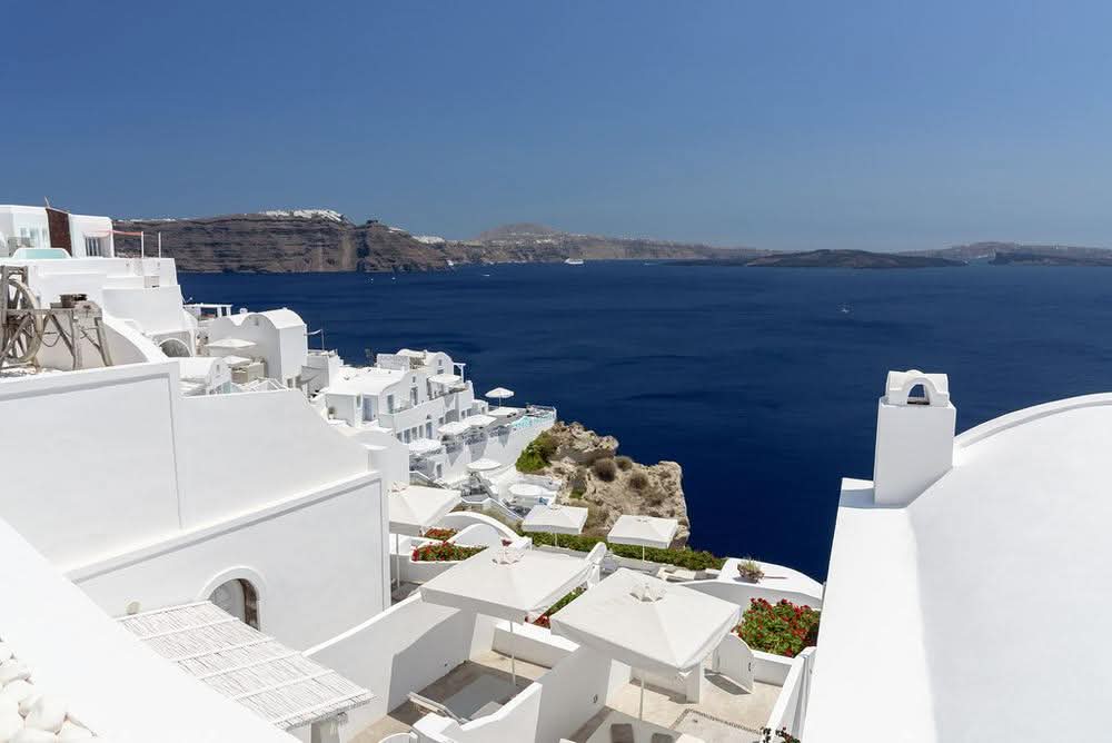 Whitewashed village of Oia above the blue Aegean, Santorini